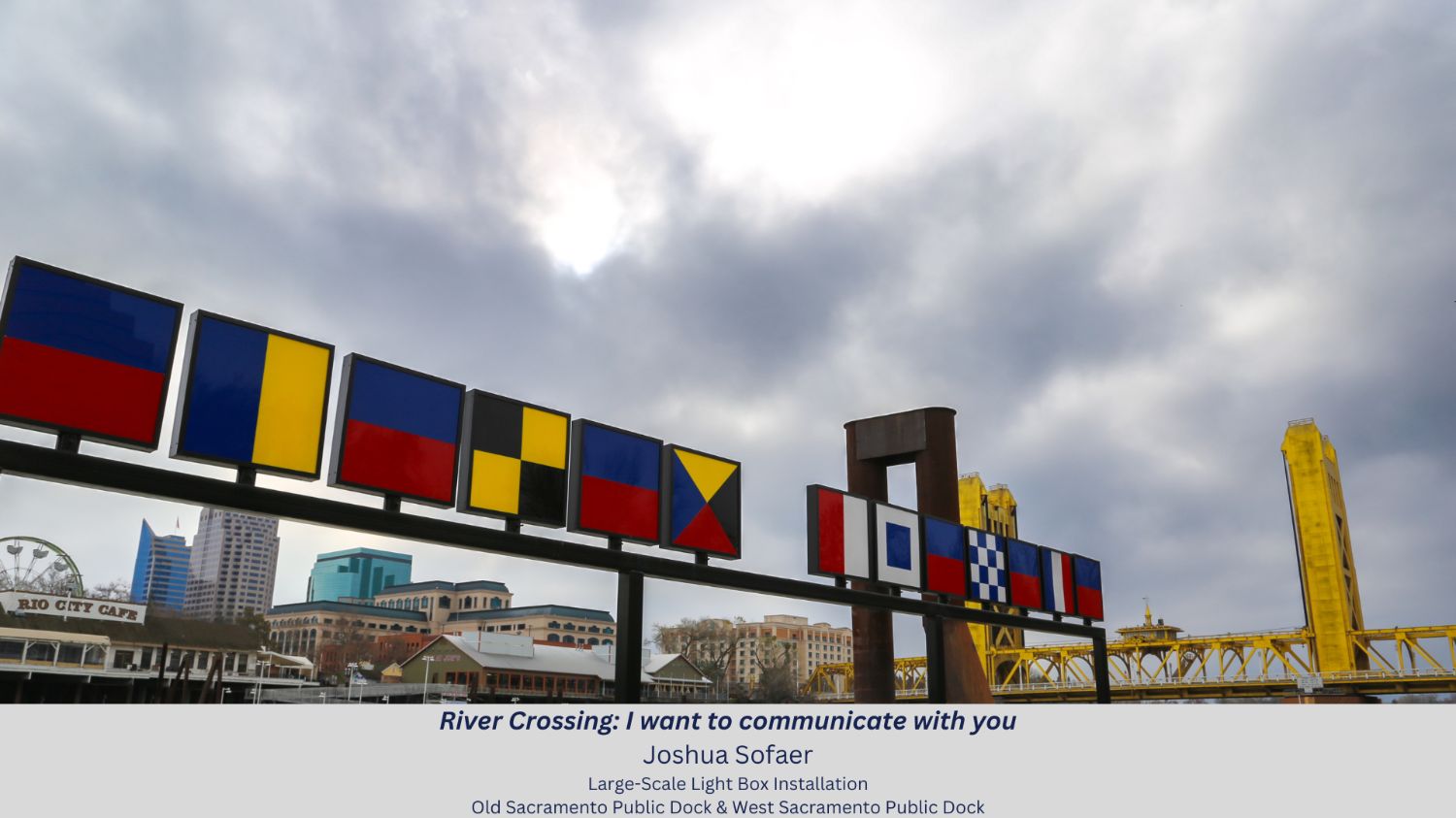 River crossing art feature with downtown sacramento behind it