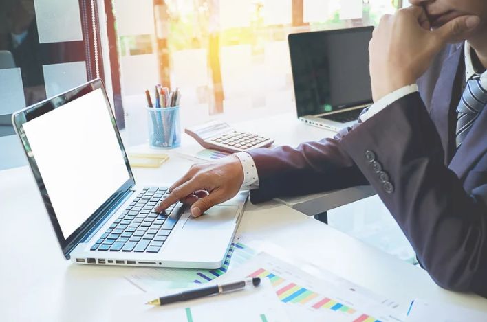 Man sitting in front of a computer