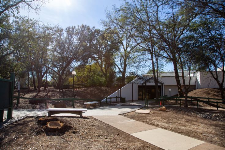 Outreach and Engagement Center, white building, trees