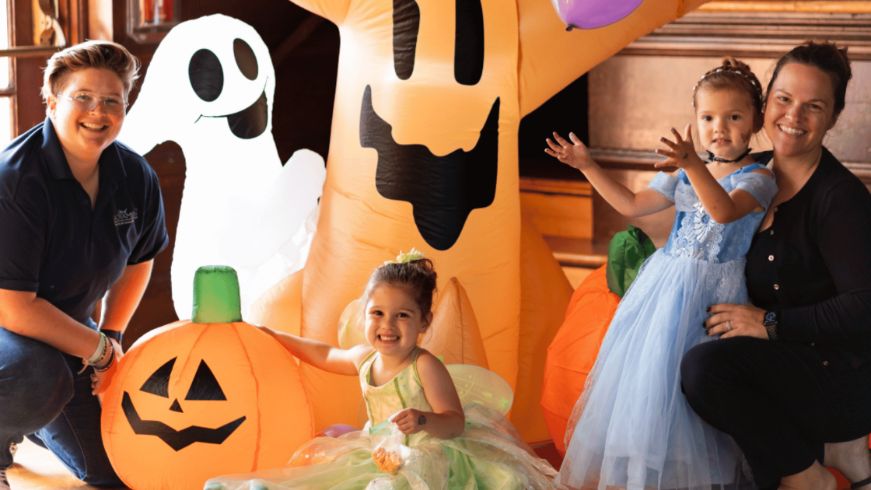 Two adults and two kids dressed up for Halloween