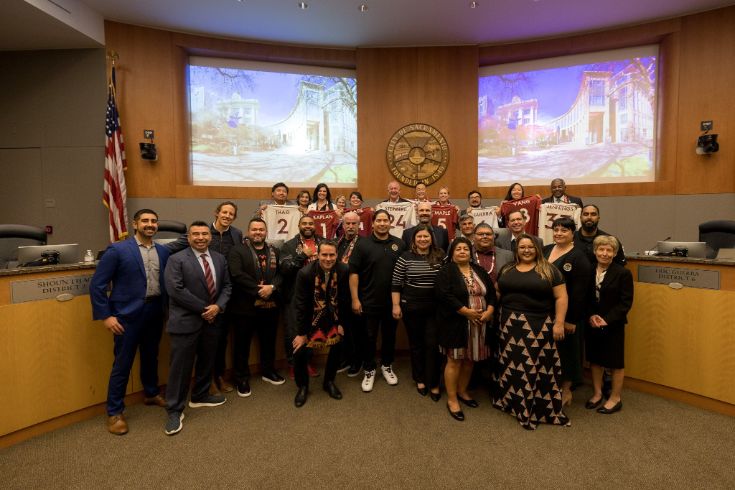 Group photo in Sacramento Council Chambers