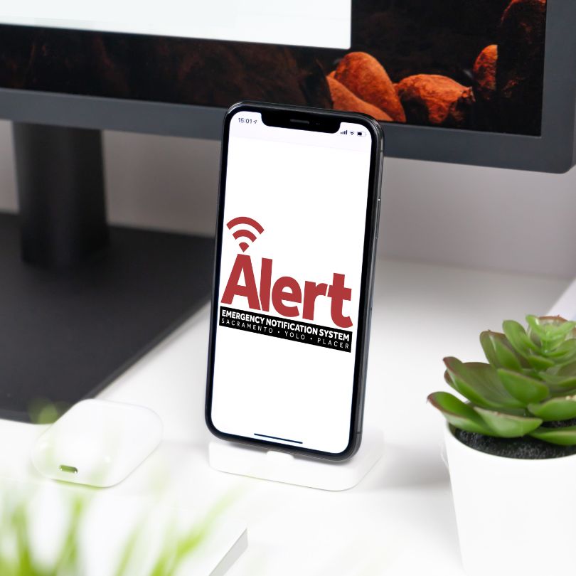 Cellphone with logo of Sacramento Alert