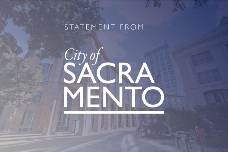 Statement, logo, City Hall in background