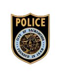 A black and gold logo showing the insignia of the Sacramento Police Department. 