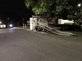 Photo of damage caused to the fence and gate surrounding the Kinney police station's parking lot