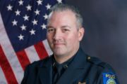 A portrait photo of the Sacramento Police Department Lieutenant Chad Coughran, in full class-A uniform