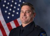 A portrait photo of the Sacramento Police Department Lieutenant Sean Cunningham, in full class-A uniform