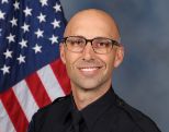 A portrait photo of the Sacramento Police Department Lieutenant Matthew McPhail, in full class-A uniform