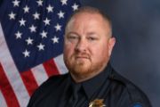 A portrait photo of the Sacramento Police Department Lieutenant Dave Putman, in full class-A uniform