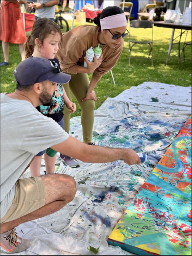 Artist and residents paint together