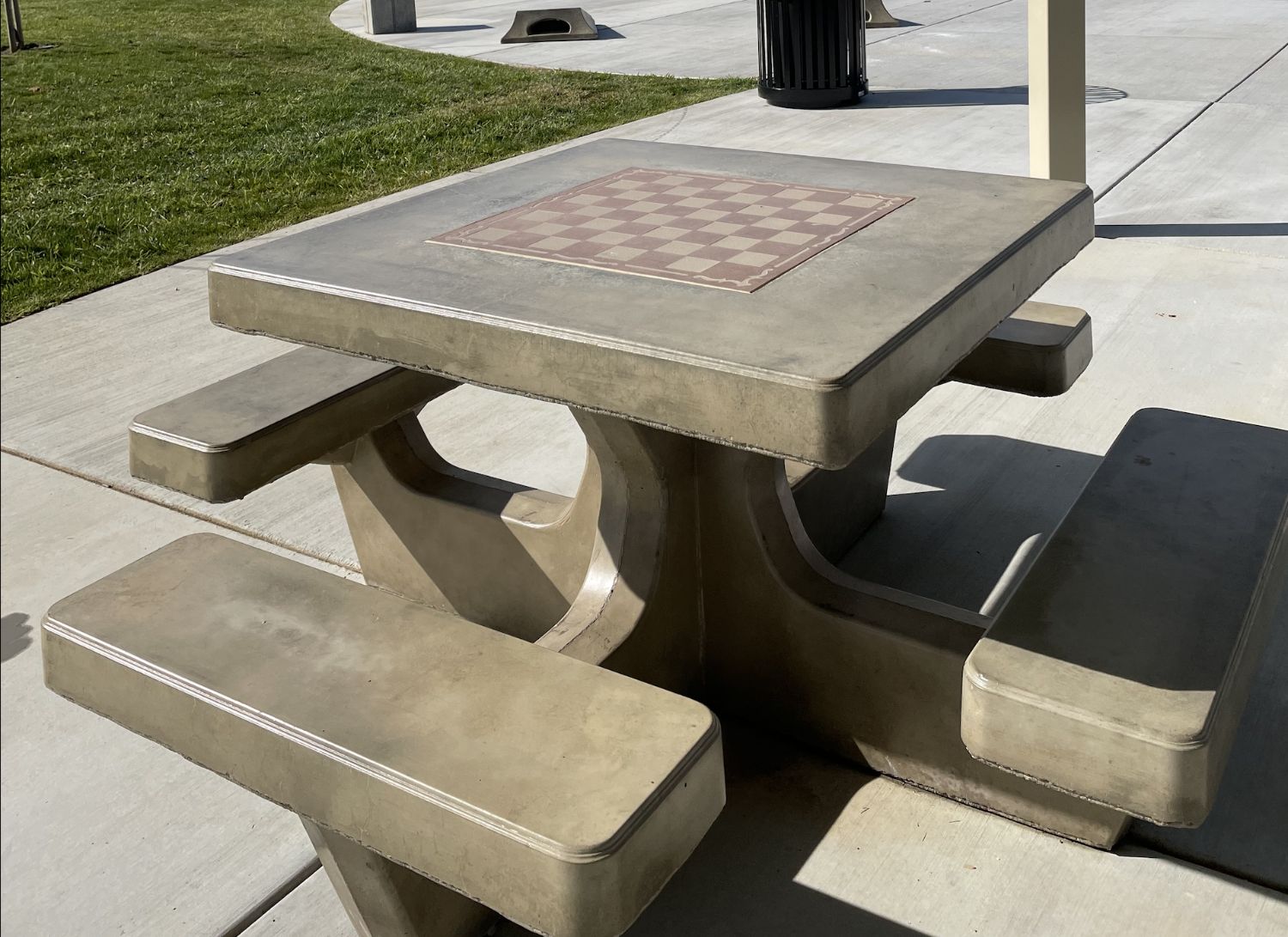 Image of a chess/checker game table at the park.