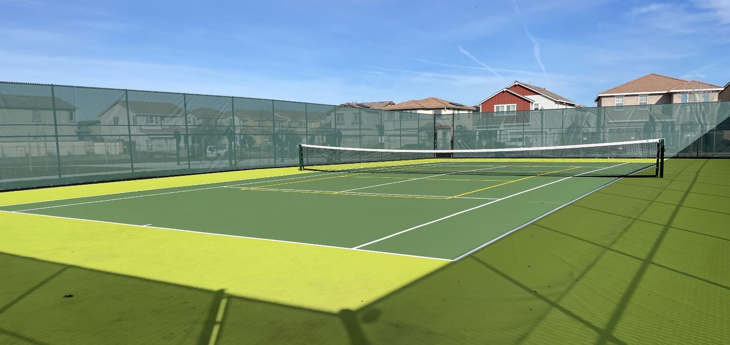 Landscape view of a Tennis Pickleball court at a park.