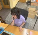 Girl on phone at desk